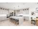 Well-equipped kitchen with stainless steel appliances, an island with bar seating, and custom cabinetry at 134 Woodlawn Ave, Decatur, GA 30030