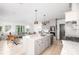 Open-concept living area featuring a kitchen island and seamlessly connected living and dining spaces at 134 Woodlawn Ave, Decatur, GA 30030