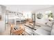Open concept living area featuring a modern kitchen with stainless steel appliances and a comfortable seating area at 134 Woodlawn Ave, Decatur, GA 30030