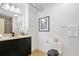 Bathroom with vanity with storage, black fixtures, and toilet at 170 Boulevard Se # E414, Atlanta, GA 30312