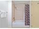 Bathroom with a tub and shower with patterned curtain at 170 Boulevard Se # E414, Atlanta, GA 30312