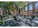 Outdoor courtyard features a fire pit with comfortable seating surrounded by trees and garden at 170 Boulevard Se # E414, Atlanta, GA 30312