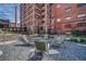 Tranquil courtyard with a fire pit and rocking chairs for relaxation amidst green landscaping at 170 Boulevard Se # E414, Atlanta, GA 30312