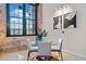 Bright dining area featuring an industrial-style window and modern furnishings at 170 Boulevard Se # E414, Atlanta, GA 30312