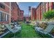 Outdoor view featuring a lawn, seating, and beautifully landscaped surroundings amidst buildings at 170 Boulevard Se # E414, Atlanta, GA 30312