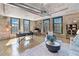 Spacious living area features exposed brick, plenty of sunlight, and an open layout, perfect for entertaining and relaxation at 170 Boulevard Se # E414, Atlanta, GA 30312