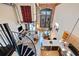 A spiral staircase overlooks this home's open living and kitchen space with exposed brick and tall windows at 170 Boulevard Se # E414, Atlanta, GA 30312