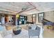Open concept living space boasting exposed brick, spiral staircase, and comfortable seating, ideal for a modern and urban lifestyle at 170 Boulevard Se # E414, Atlanta, GA 30312