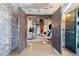 Inviting living room featuring exposed brick and large wooden doors, creating a unique industrial-chic aesthetic at 170 Boulevard Se # E414, Atlanta, GA 30312