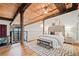 Luxurious bedroom features hardwood floors and exposed wooden beams, offering a cozy and elegant retreat at 170 Boulevard Se # E414, Atlanta, GA 30312