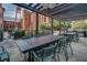 Outdoor dining area with built-in grills, tables, and chairs for al fresco gatherings at 170 Boulevard Se # E414, Atlanta, GA 30312