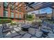 Outdoor patio with stone table and chairs under a pergola offering a place to gather at 170 Boulevard Se # E414, Atlanta, GA 30312