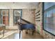 Stylish interior featuring a piano next to window with exposed brick walls creating an industrial-chic aesthetic at 170 Boulevard Se # E414, Atlanta, GA 30312
