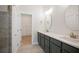 Bathroom with dual sinks and access to a walk-in closet at 2215 Nena Way # 20, Tucker, GA 30084