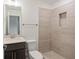 Modern bathroom with a walk-in shower with niche, tan tile and modern vanity at 2215 Nena Way # 20, Tucker, GA 30084