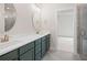 Bright bathroom features a dual sink vanity, shower, and modern finishes at 2215 Nena Way # 20, Tucker, GA 30084
