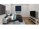 Modern bedroom featuring a bed, side table, tv and stylish decor at 2215 Nena Way # 20, Tucker, GA 30084