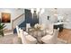 Modern dining room with a clear table, stylish chandelier, and accent wall at 2215 Nena Way # 20, Tucker, GA 30084