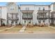 Townhome exterior with a green front door, porch, and landscaped front yard at 2215 Nena Way # 20, Tucker, GA 30084