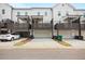 Townhome exterior boasts a contemporary facade, with attached garages and private balconies offering space and curb appeal at 2215 Nena Way # 20, Tucker, GA 30084