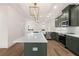Modern kitchen with a large island, stainless steel appliances, and hardwood floors at 2215 Nena Way # 20, Tucker, GA 30084
