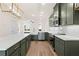 Kitchen features an island, stainless steel appliances, and custom pendant lighting at 2215 Nena Way # 20, Tucker, GA 30084