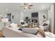 Bright living room features a fireplace, ceiling fan, and neutral color palette at 2215 Nena Way # 20, Tucker, GA 30084