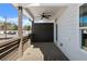 View of a spacious patio with a ceiling fan and access door, offering a seamless transition between indoor and outdoor living at 2215 Nena Way # 20, Tucker, GA 30084
