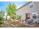 Spacious backyard with patio seating, lush lawn, established landscaping, storage shed and a privacy fence at 238 Diamond Valley Pass, Canton, GA 30114