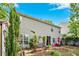 Spacious backyard with patio seating, lush lawn, established landscaping, privacy fence, and mature trees at 238 Diamond Valley Pass, Canton, GA 30114