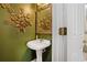 Charming powder room featuring a pedestal sink and decorative accents at 238 Diamond Valley Pass, Canton, GA 30114