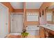 Bright bathroom with a double sink vanity, a soaking tub, and a separate enclosed shower at 238 Diamond Valley Pass, Canton, GA 30114