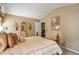 Neutral bedroom featuring soft lighting, a large bed, and wood floors at 238 Diamond Valley Pass, Canton, GA 30114