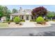 Community clubhouse featuring a covered entrance and a manicured lawn with lush green bushes and trees at 238 Diamond Valley Pass, Canton, GA 30114