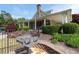 Community clubhouse featuring an outdoor grill, picnic area, and lush green bushes and trees at 238 Diamond Valley Pass, Canton, GA 30114