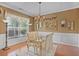 Bright dining room with hardwood floors, decorative accents, and a glass-top table at 238 Diamond Valley Pass, Canton, GA 30114