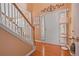 Inviting foyer with hardwood floors, a staircase, and a bright, welcoming entrance at 238 Diamond Valley Pass, Canton, GA 30114