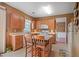 Eat-in kitchen featuring wood cabinets, tile floors, and a center island at 238 Diamond Valley Pass, Canton, GA 30114