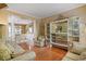 Spacious living room with hardwood floors, stylish decor, and an open layout to the dining area at 238 Diamond Valley Pass, Canton, GA 30114