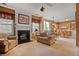 Cozy living room featuring a fireplace and view of the breakfast nook at 238 Diamond Valley Pass, Canton, GA 30114