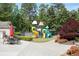 Community playground with colorful equipment, a picnic area, and lush landscaping, designed for Gathering fun at 238 Diamond Valley Pass, Canton, GA 30114