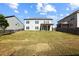 Large backyard featuring a covered patio and privacy fence, perfect for outdoor entertaining at 345 Varenna Ln, Sugar Hill, GA 30518
