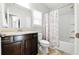 Bathroom featuring a shower-tub combo with vanity sink and tile flooring at 345 Varenna Ln, Sugar Hill, GA 30518