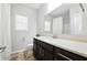 Bathroom featuring modern vanity with ample storage and a combined tub and shower at 345 Varenna Ln, Sugar Hill, GA 30518