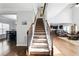 Grand foyer with high ceilings, staircase, and hardwood floors at 345 Varenna Ln, Sugar Hill, GA 30518
