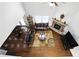 A living room with a stone fireplace, high ceiling and comfortable leather furniture at 345 Varenna Ln, Sugar Hill, GA 30518