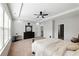 Large primary bedroom with ceiling fan, tray ceiling and lots of light at 345 Varenna Ln, Sugar Hill, GA 30518