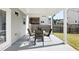 Cozy outdoor patio with a table and chairs, perfect for relaxing and enjoying the outdoors at 345 Varenna Ln, Sugar Hill, GA 30518