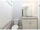 Clean bathroom featuring a shower with curtain and a vanity with a gray countertop at 555 Letchas Ln, Alpharetta, GA 30009