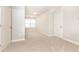 The versatile bonus room has neutral walls, carpeting, and two doors, showing flexibility for use at 555 Letchas Ln, Alpharetta, GA 30009